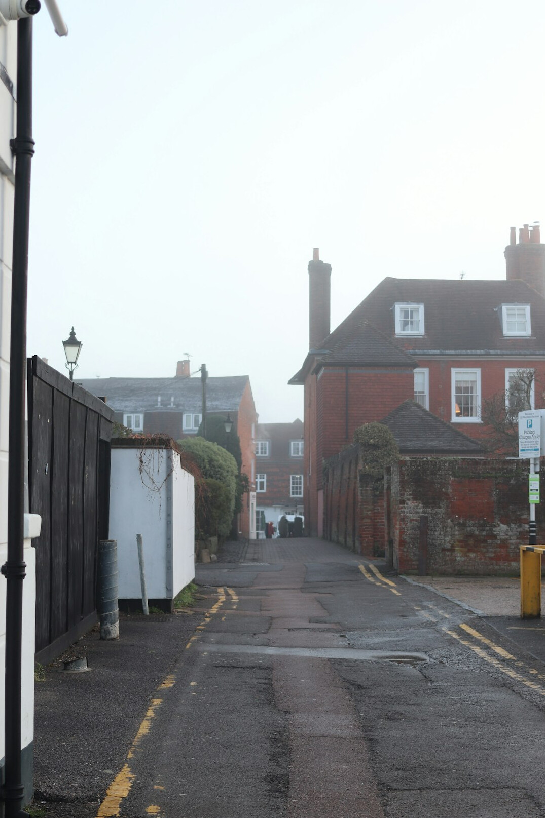 Foggy cobblestone street in an old town