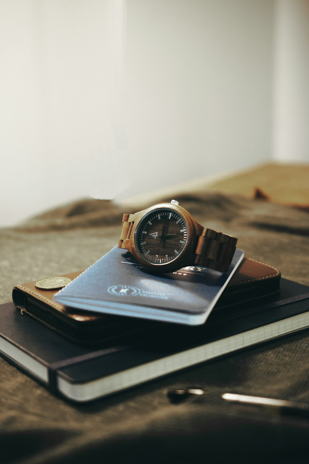 Open notebook with a magnifying glass on a wooden desk
